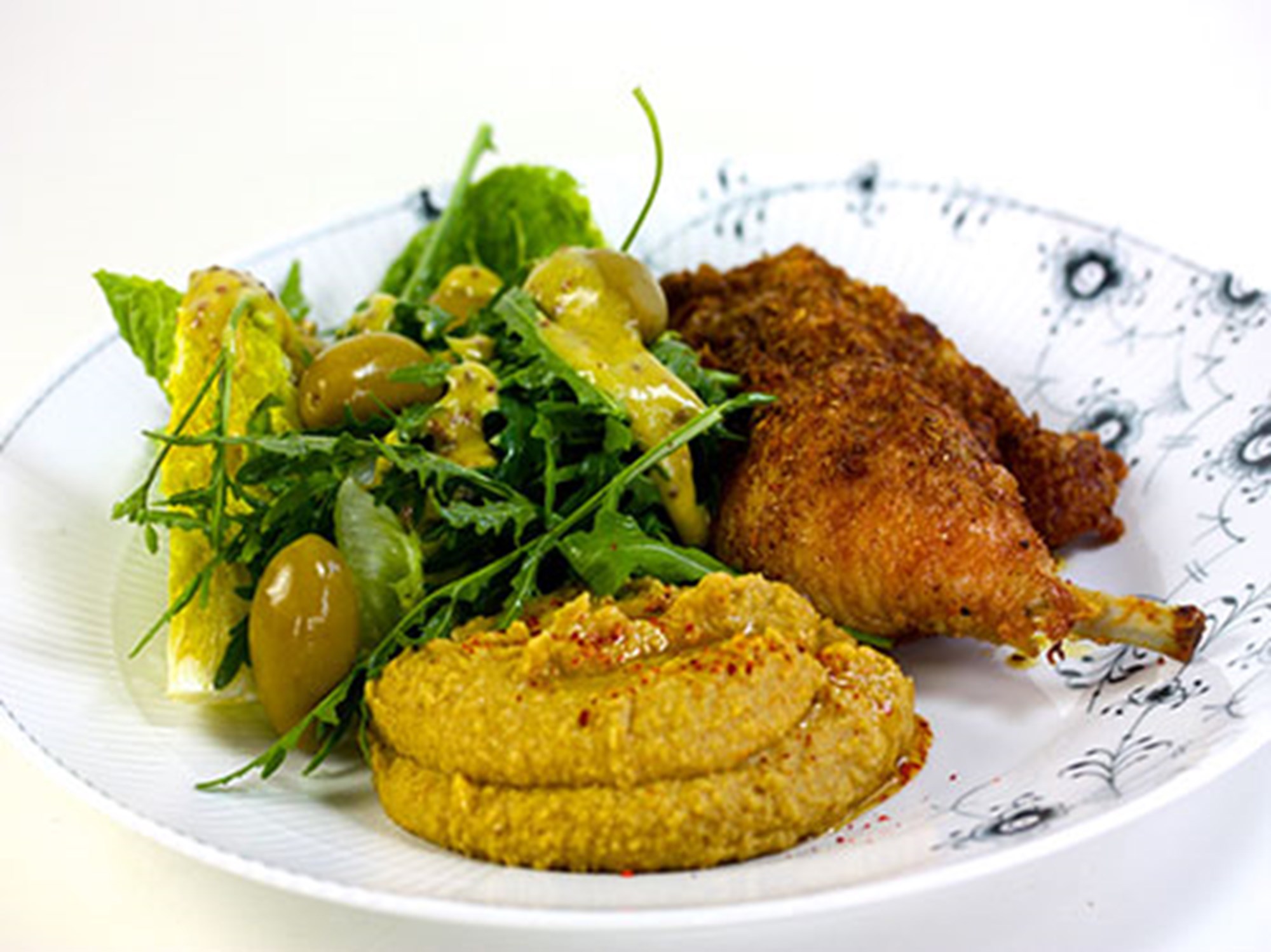 Stegte kyllingelår med Ras el hanout og humus og salat